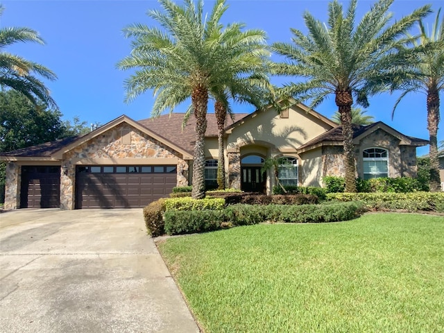 2041 Gold Dust Ct, Trinity, FL 34655 - view of front facade with stone siding, an attached garage, a front lawn, and driveway