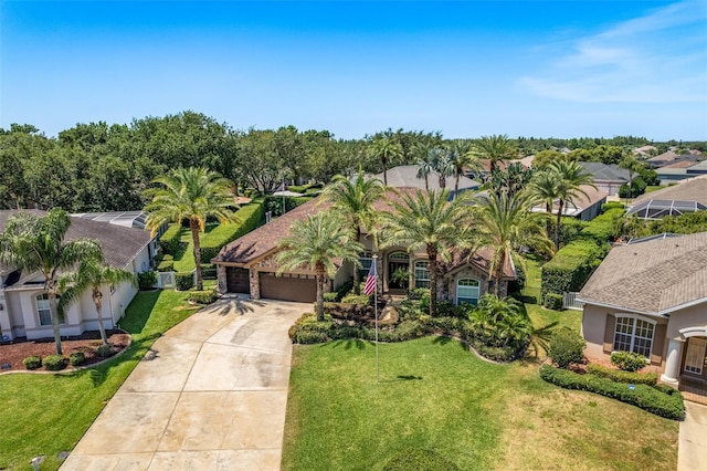 2041 Gold Dust Ct, Trinity, FL 34655 - mediterranean / spanish home featuring driveway, a garage, a front yard, stucco siding, and a residential view