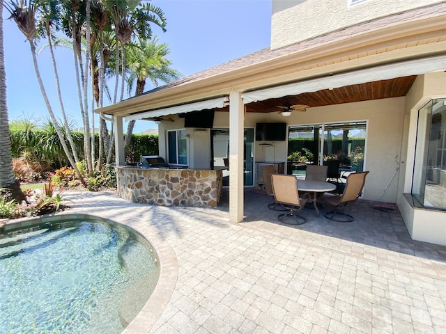 2041 Gold Dust Ct, Trinity, FL 34655 - view of pool with an outdoor kitchen, a patio, and ceiling fan