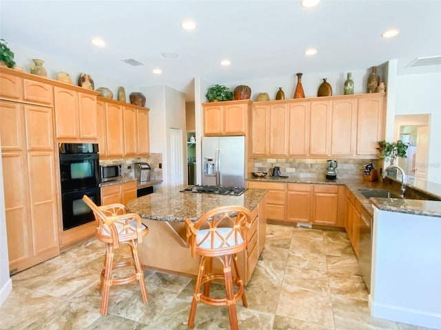 2041 Gold Dust Ct, Trinity, FL 34655 - kitchen featuring appliances with stainless steel finishes, a sink, light brown cabinetry, and recessed lighting