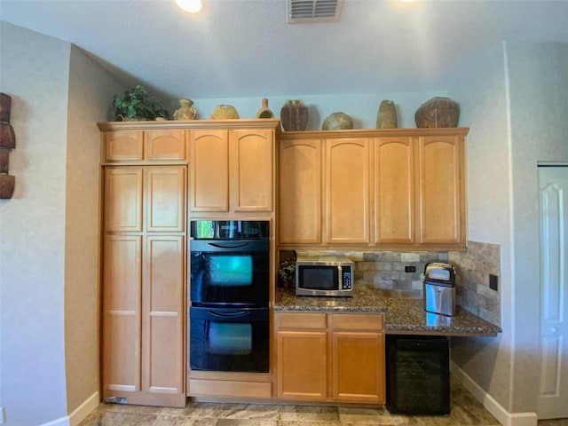 2041 Gold Dust Ct, Trinity, FL 34655 - kitchen featuring stainless steel microwave, baseboards, dark stone counters, light brown cabinets, and backsplash