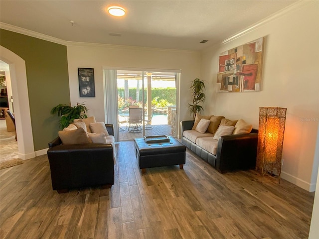 2041 Gold Dust Ct, Trinity, FL 34655 - living room with arched walkways, crown molding, wood finished floors, and baseboards