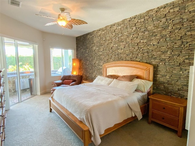 2041 Gold Dust Ct, Trinity, FL 34655 - carpeted bedroom with access to exterior and ceiling fan