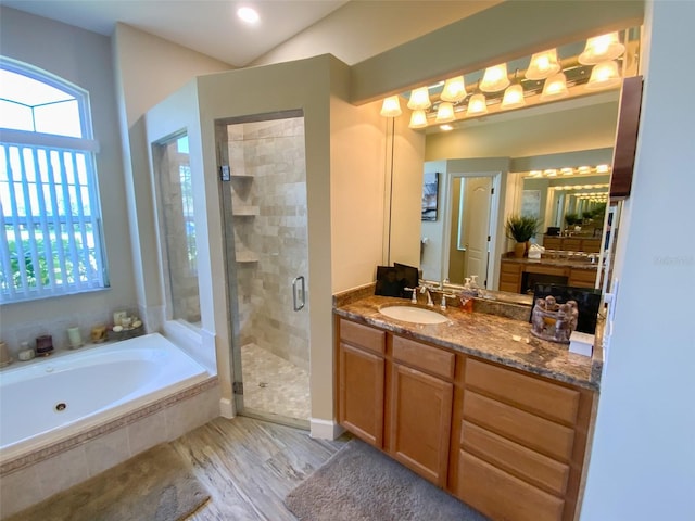 2041 Gold Dust Ct, Trinity, FL 34655 - full bathroom featuring a shower stall, a bath, and vanity
