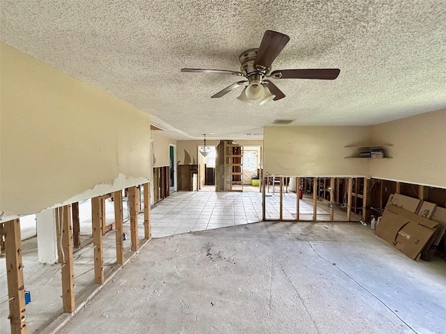 14318 Guava St, Hudson, FL 34667 - spare room with a textured ceiling and a ceiling fan