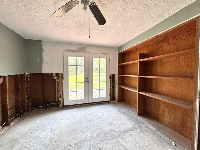 14318 Guava St, Hudson, FL 34667 - spare room with french doors, a textured ceiling, and ceiling fan