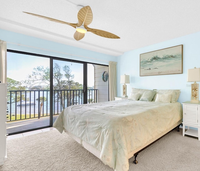 2700 Bayshore Blvd Unit 11308, Dunedin, FL 34698 - bedroom with access to exterior, ceiling fan, and carpet flooring