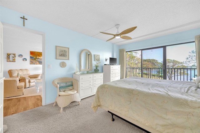 2700 Bayshore Blvd Unit 11308, Dunedin, FL 34698 - carpeted bedroom featuring access to outside and ceiling fan