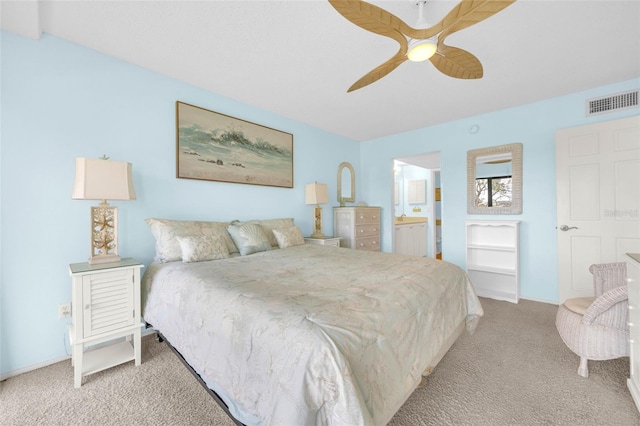 2700 Bayshore Blvd Unit 11308, Dunedin, FL 34698 - carpeted bedroom with connected bathroom and a ceiling fan