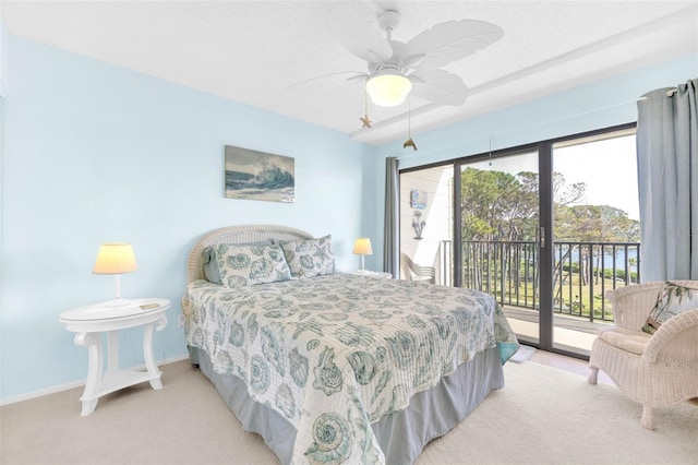 2700 Bayshore Blvd Unit 11308, Dunedin, FL 34698 - carpeted bedroom featuring access to exterior, baseboards, and a ceiling fan