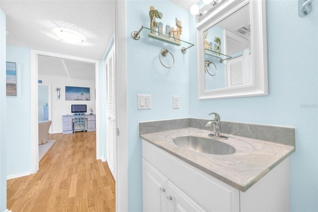 2700 Bayshore Blvd Unit 11308, Dunedin, FL 34698 - bathroom with wood finished floors, vanity, and baseboards