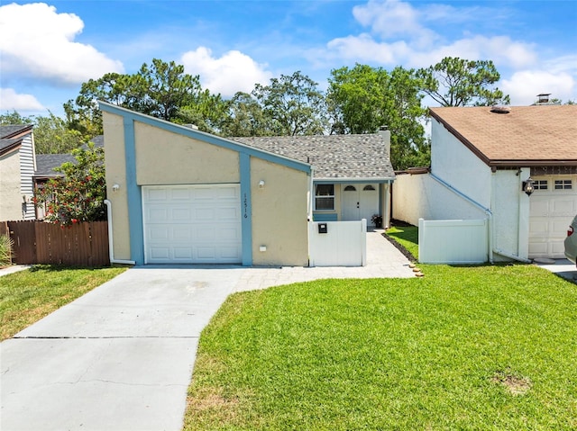 12516 Cobble Stone Dr, Hudson, FL 34667 - mid-century inspired home featuring driveway, a garage, stucco siding, and roof with shingles