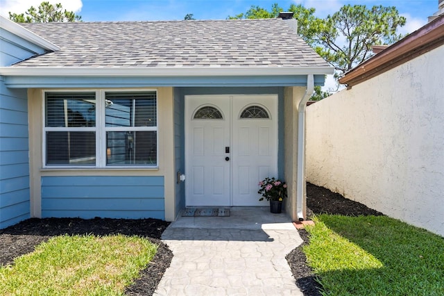 12516 Cobble Stone Dr, Hudson, FL 34667 - property entrance featuring a shingled roof