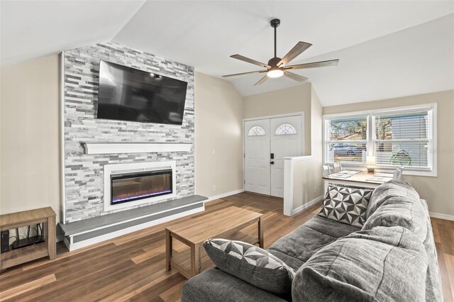 12516 Cobble Stone Dr, Hudson, FL 34667 - living area with vaulted ceiling, wood finished floors, ceiling fan, baseboards, and a large fireplace