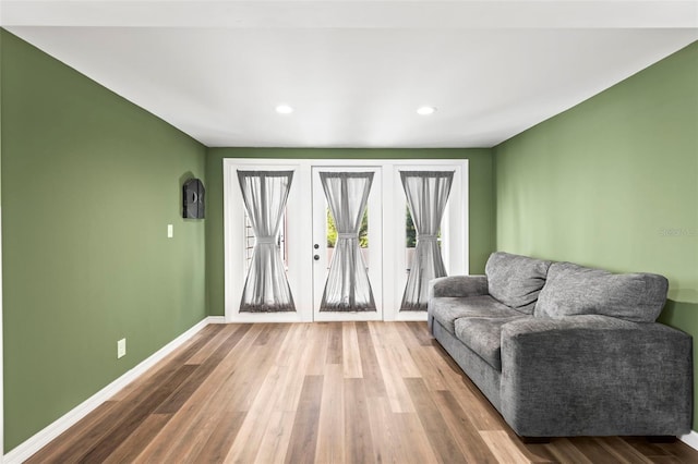 12516 Cobble Stone Dr, Hudson, FL 34667 - living area with wood finished floors, baseboards, and recessed lighting