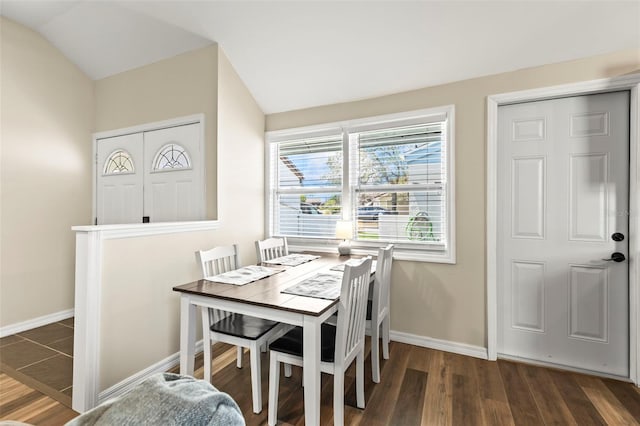 12516 Cobble Stone Dr, Hudson, FL 34667 - dining room with lofted ceiling, baseboards, and wood finished floors
