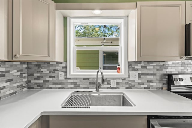 12516 Cobble Stone Dr, Hudson, FL 34667 - kitchen with a sink, stainless steel appliances, light countertops, and decorative backsplash
