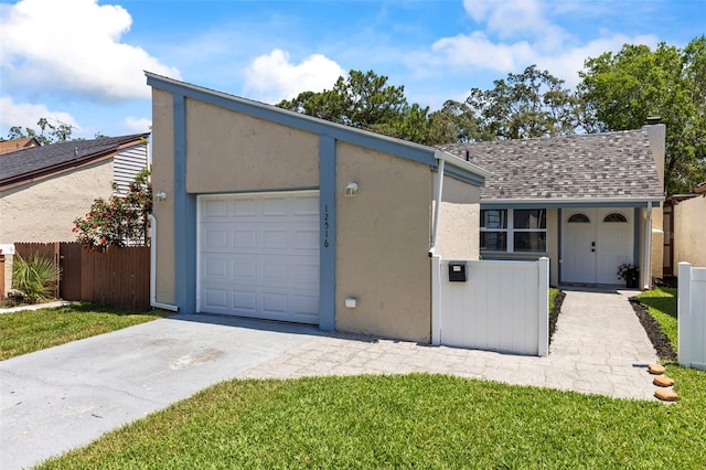 12516 Cobble Stone Dr, Hudson, FL 34667 - view of front of home featuring concrete driveway, roof with shingles, stucco siding, an attached garage, and a chimney