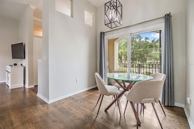 501 Knights Run Ave Unit 6104, Tampa, FL 33602 - dining space featuring dark wood finished floors, baseboards, and a towering ceiling