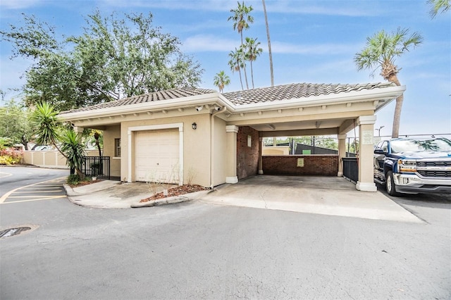 501 Knights Run Ave Unit 6104, Tampa, FL 33602 - view of front of property with a tile roof, stucco siding, and driveway