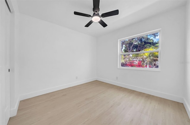 8433 101st Ave, Seminole, FL 33777 - spare room featuring light wood-style floors, baseboards, and a ceiling fan