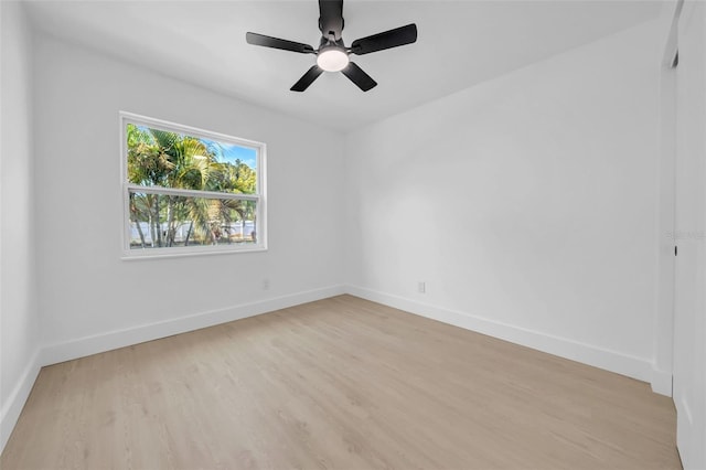 8433 101st Ave, Seminole, FL 33777 - spare room featuring light wood-style floors, baseboards, and ceiling fan