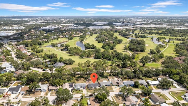 8433 101st Ave, Seminole, FL 33777 - aerial view of property and surrounding area with a local golf course, a nearby body of water, and nearby suburban area