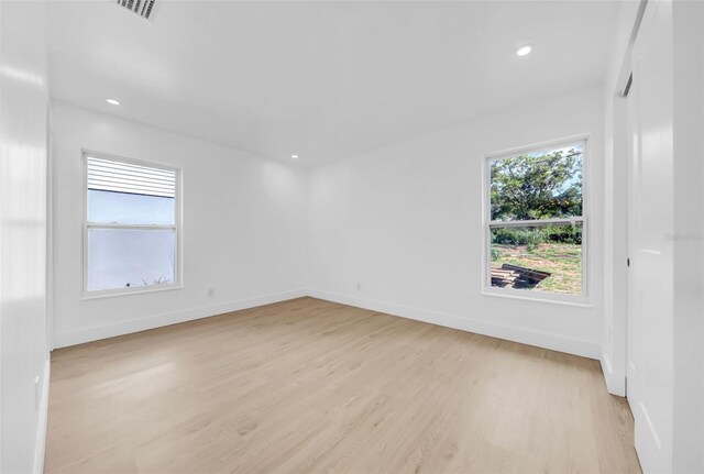 8433 101st Ave, Seminole, FL 33777 - spare room with light wood-style flooring, baseboards, and recessed lighting
