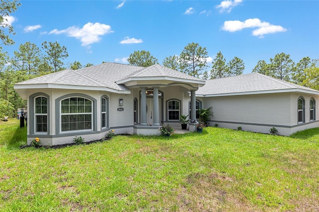 5032 N Crossgate Pt, Beverly Hills, FL 34465 - view of front of house with a front yard and stucco siding