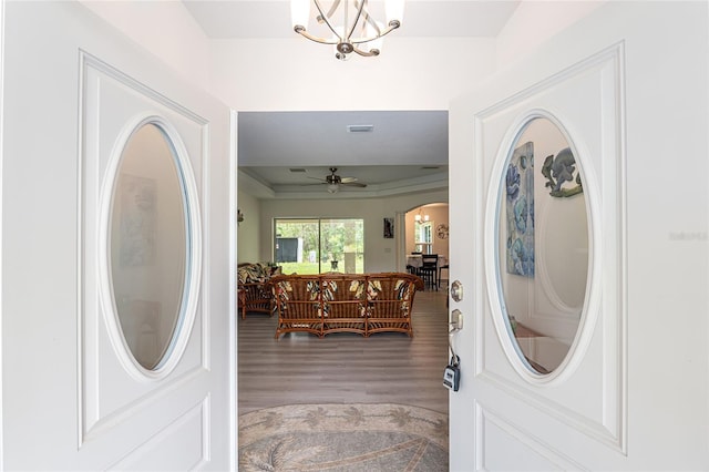 5032 N Crossgate Pt, Beverly Hills, FL 34465 - foyer entrance with wood finished floors, arched walkways, ceiling fan, a chandelier, and a raised ceiling