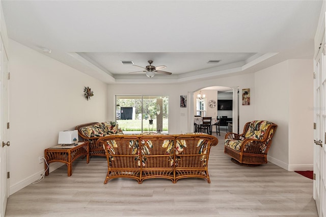 5032 N Crossgate Pt, Beverly Hills, FL 34465 - dining area featuring arched walkways, a raised ceiling, ceiling fan, and light wood finished floors