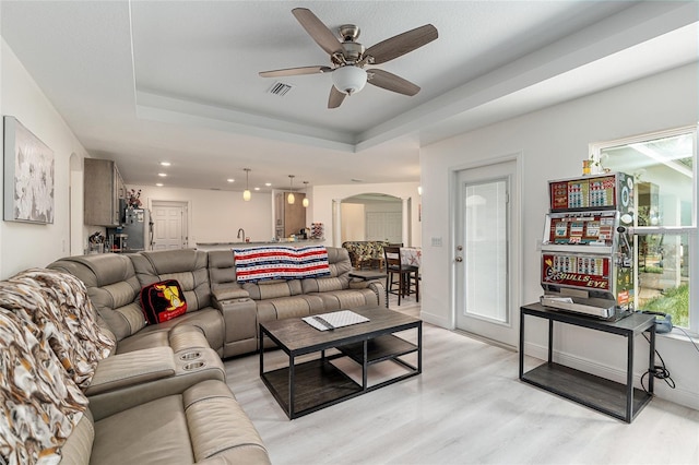 5032 N Crossgate Pt, Beverly Hills, FL 34465 - living area with arched walkways, ceiling fan, light wood-type flooring, a raised ceiling, and recessed lighting