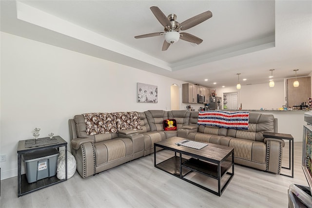 5032 N Crossgate Pt, Beverly Hills, FL 34465 - living room with light wood-style floors, a raised ceiling, recessed lighting, a ceiling fan, and arched walkways