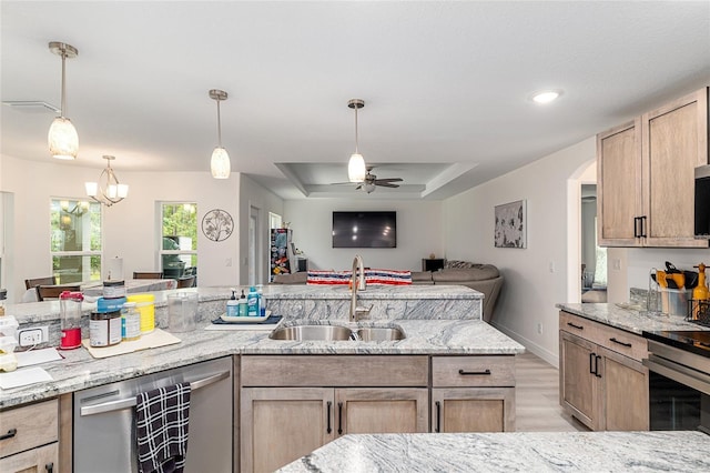 5032 N Crossgate Pt, Beverly Hills, FL 34465 - kitchen with a sink, open floor plan, appliances with stainless steel finishes, a ceiling fan, and light stone countertops