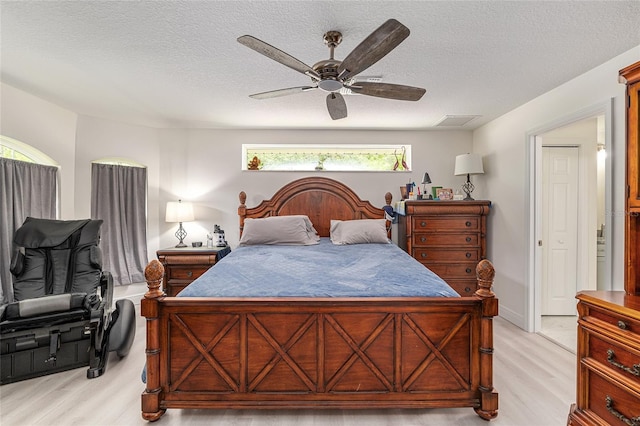 5032 N Crossgate Pt, Beverly Hills, FL 34465 - bedroom featuring light wood-type flooring, ceiling fan, and a textured ceiling