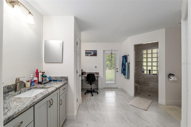 5032 N Crossgate Pt, Beverly Hills, FL 34465 - bathroom with walk in shower, vanity, baseboards, a textured ceiling, and marble finish flooring