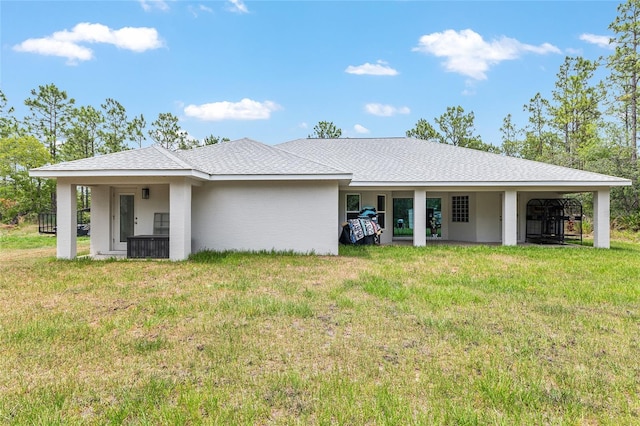 5032 N Crossgate Pt, Beverly Hills, FL 34465 - rear view of house featuring a lawn