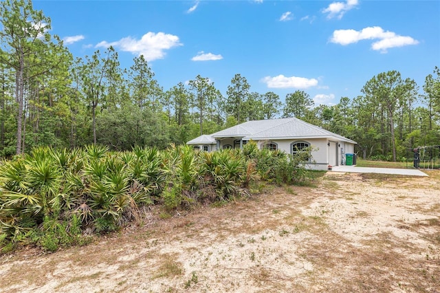 5032 N Crossgate Pt, Beverly Hills, FL 34465 - view of home's exterior with an attached garage and driveway