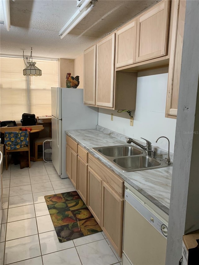 2901 NW 48th Ave Unit 367, Lauderdale Lakes, FL 33313 - kitchen featuring white appliances, a sink, light brown cabinetry, light countertops, and a textured ceiling