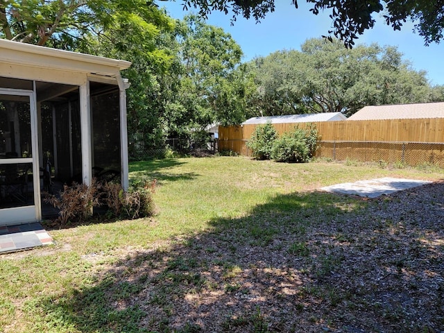 7317 Mitchell Ranch Rd, New Port Richey, FL 34655 - view of yard featuring a sunroom