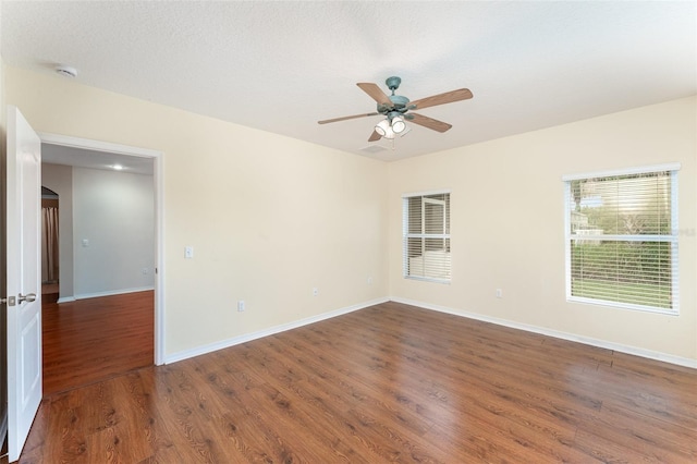 6898 Glenbrook Dr, Lakeland, FL 33811 - spare room featuring ceiling fan, wood finished floors, baseboards, and a smoke detector