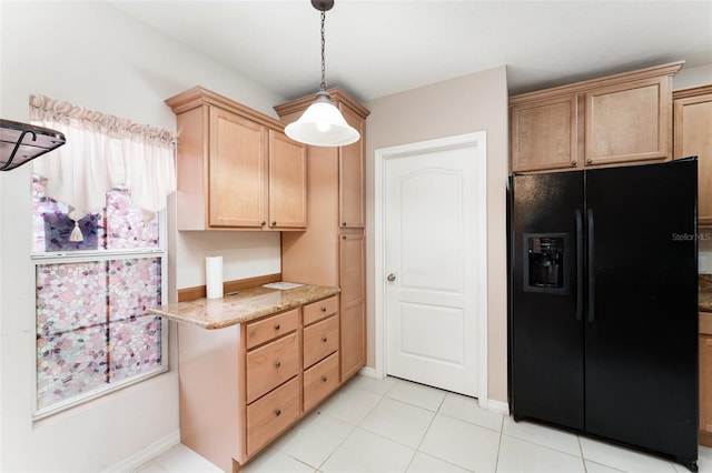 6898 Glenbrook Dr, Lakeland, FL 33811 - kitchen with black fridge with ice dispenser, light brown cabinets, healthy amount of natural light, and light stone countertops