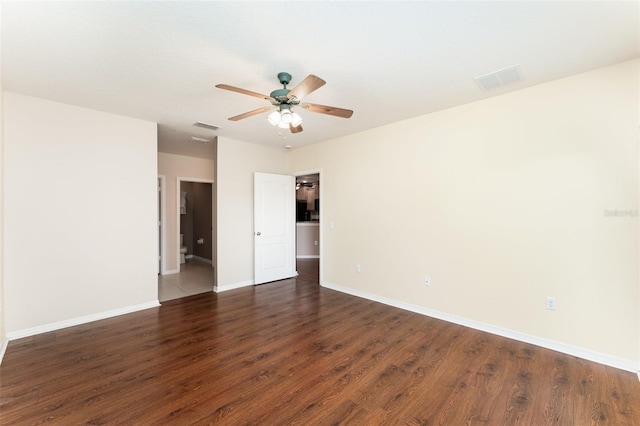 6898 Glenbrook Dr, Lakeland, FL 33811 - empty room with wood finished floors, a ceiling fan, and baseboards