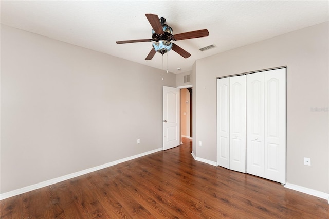 6898 Glenbrook Dr, Lakeland, FL 33811 - unfurnished bedroom with wood finished floors, baseboards, and a closet
