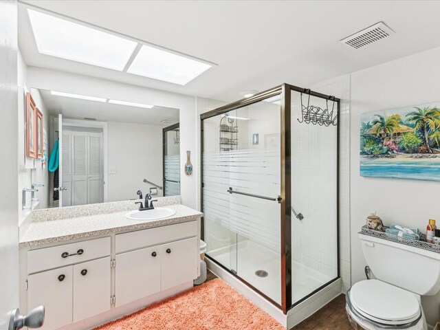 10216 Regal Dr Unit 409, Largo, FL 33774 - bathroom with toilet, vanity, and a stall shower