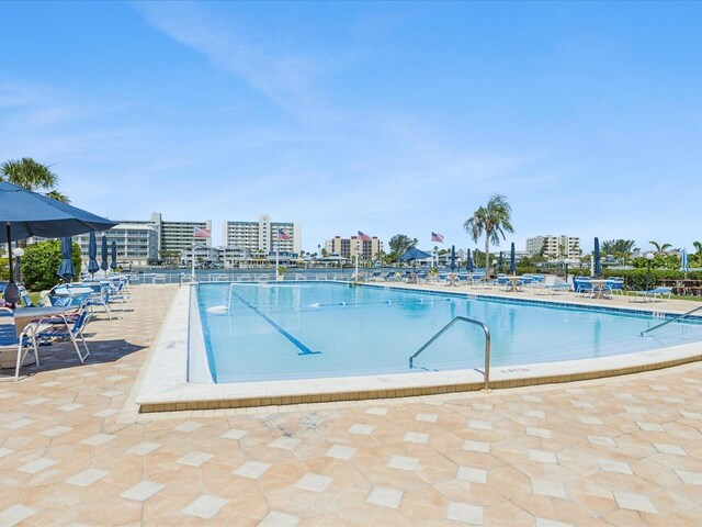 10216 Regal Dr Unit 409, Largo, FL 33774 - community pool featuring a patio