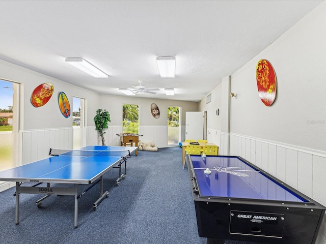 10216 Regal Dr Unit 409, Largo, FL 33774 - game room featuring wainscoting, carpet floors, and ceiling fan