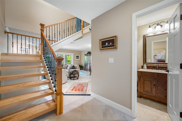 903 Pinellas Bayway S Unit 103, Tierra Verde, FL 33715 - stairs featuring baseboards
