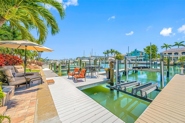 903 Pinellas Bayway S Unit 103, Tierra Verde, FL 33715 - dock featuring boat lift and a water view