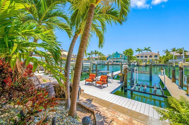 903 Pinellas Bayway S Unit 103, Tierra Verde, FL 33715 - dock with boat lift and a water view